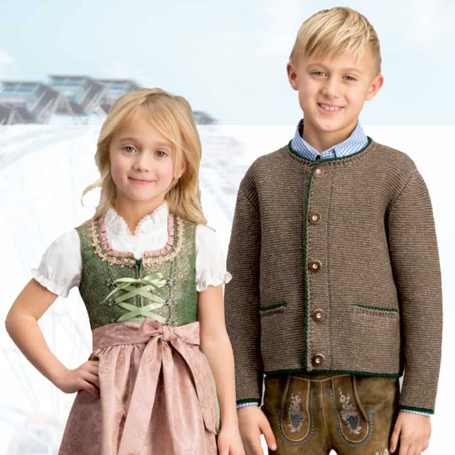 Mädchen im Dirndl und Junge in Lederhosen